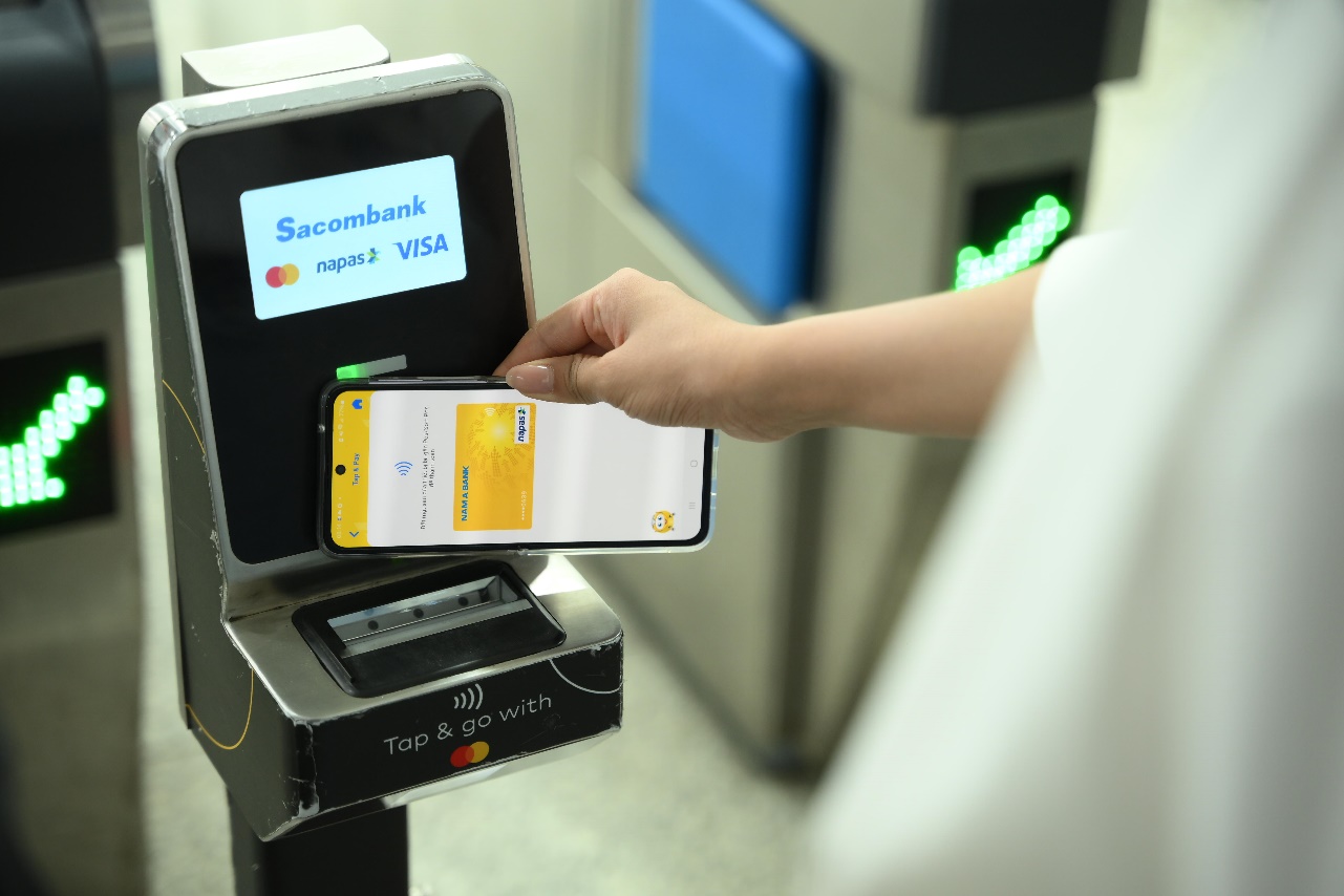 A person using a phone to pay for a credit card  AI-generated content may be incorrect.