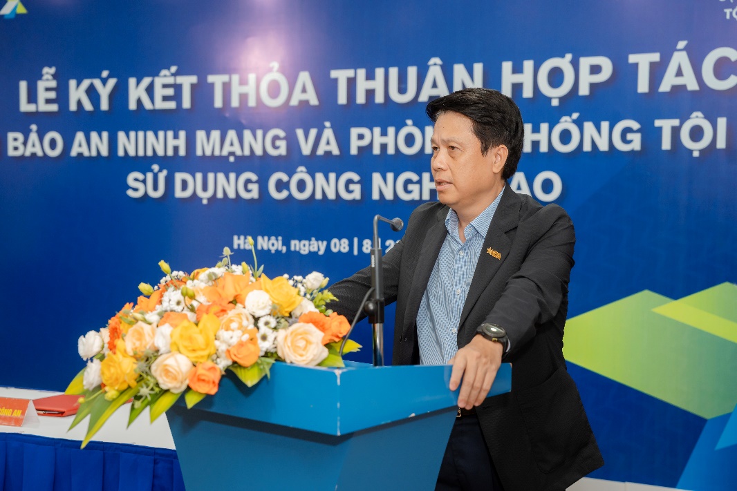 A person standing at a podium with a microphone and flowers  AI-generated content may be incorrect.